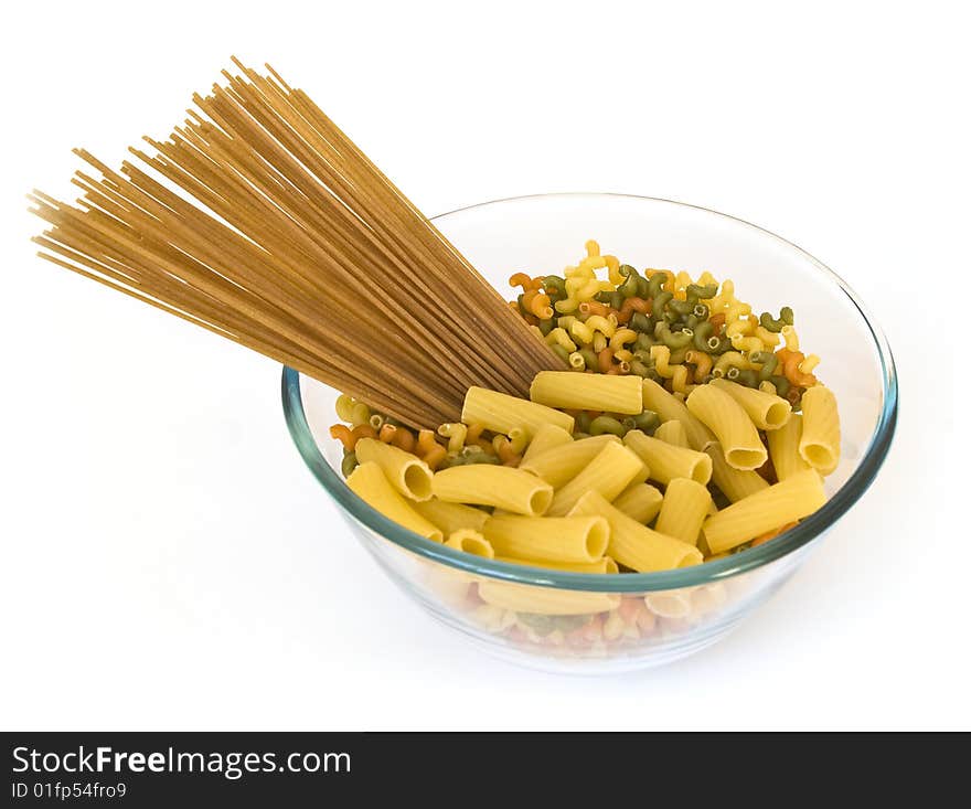 Colorful noodles in a bowl isolated on white