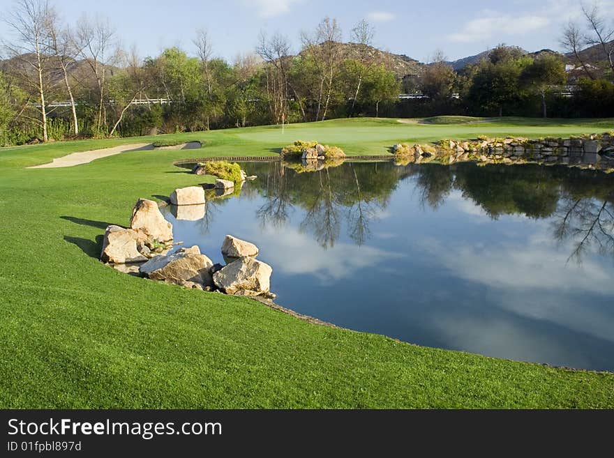 Golf Green and Lake on a Beautiful Morning.