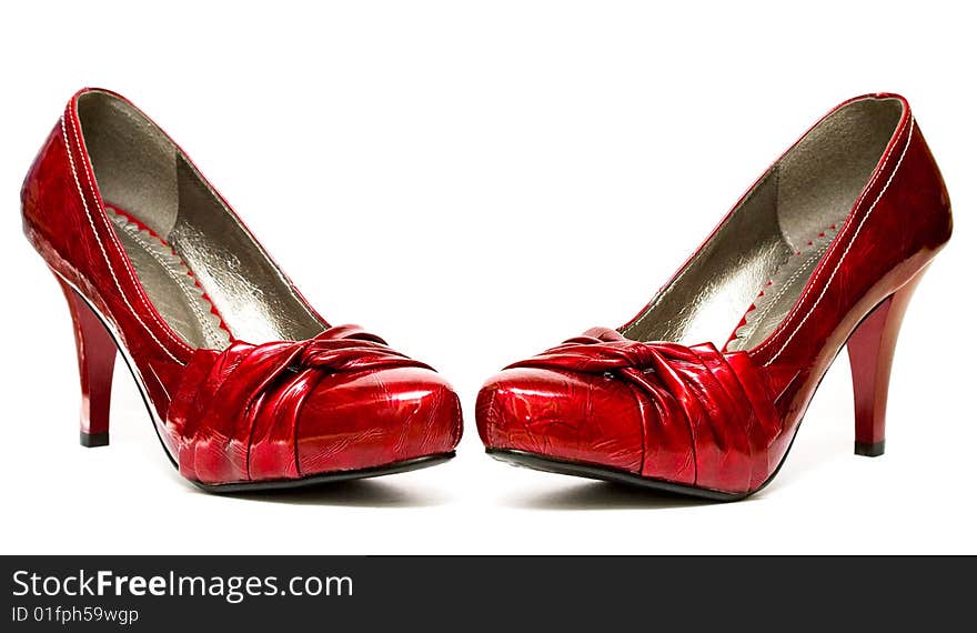 Red womanish shoes isolated on white background