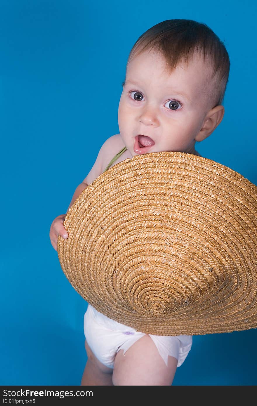 Portrait of little boy with the Chinese hat in hands. Portrait of little boy with the Chinese hat in hands