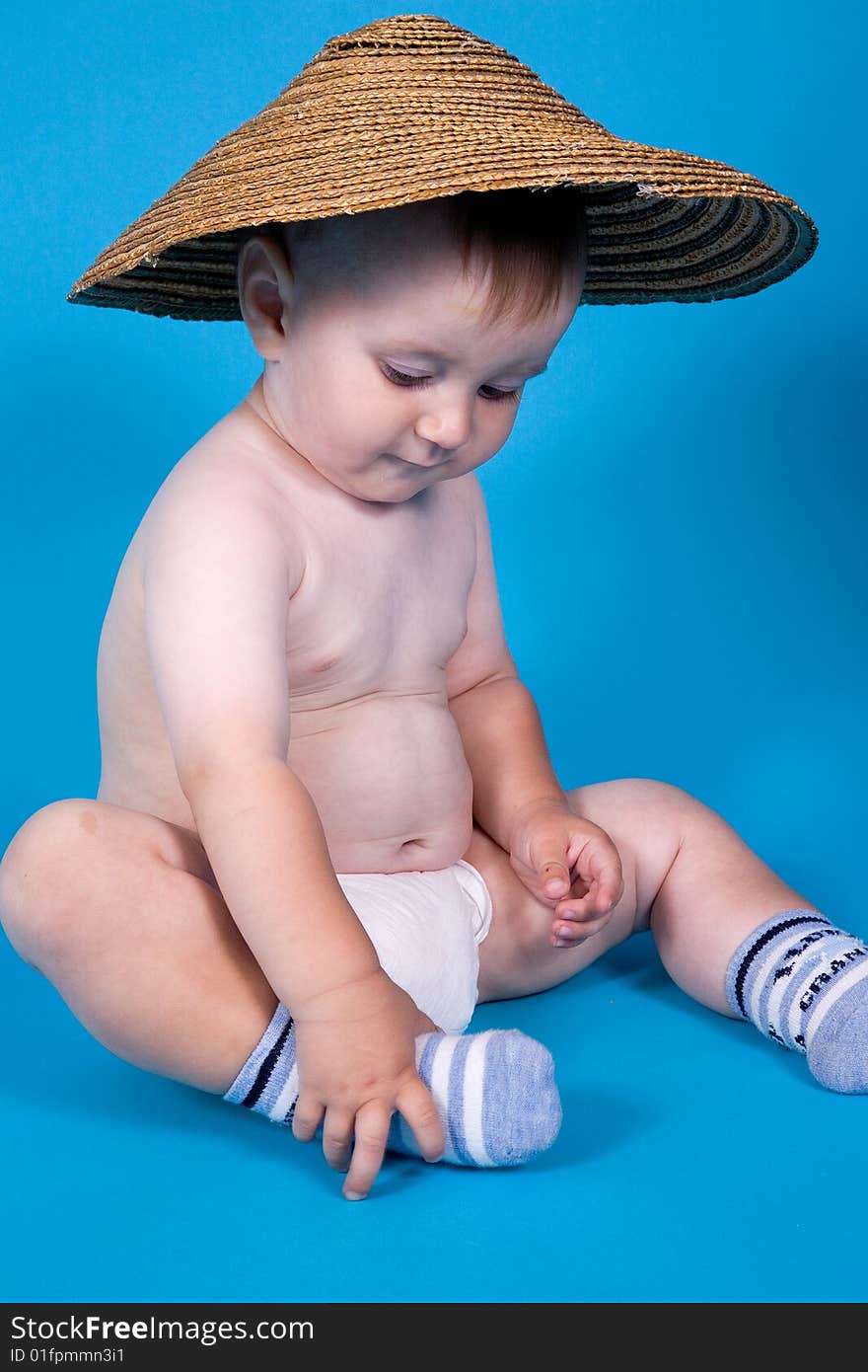 Portrait of little boy in the Chinese hat on a head. Portrait of little boy in the Chinese hat on a head