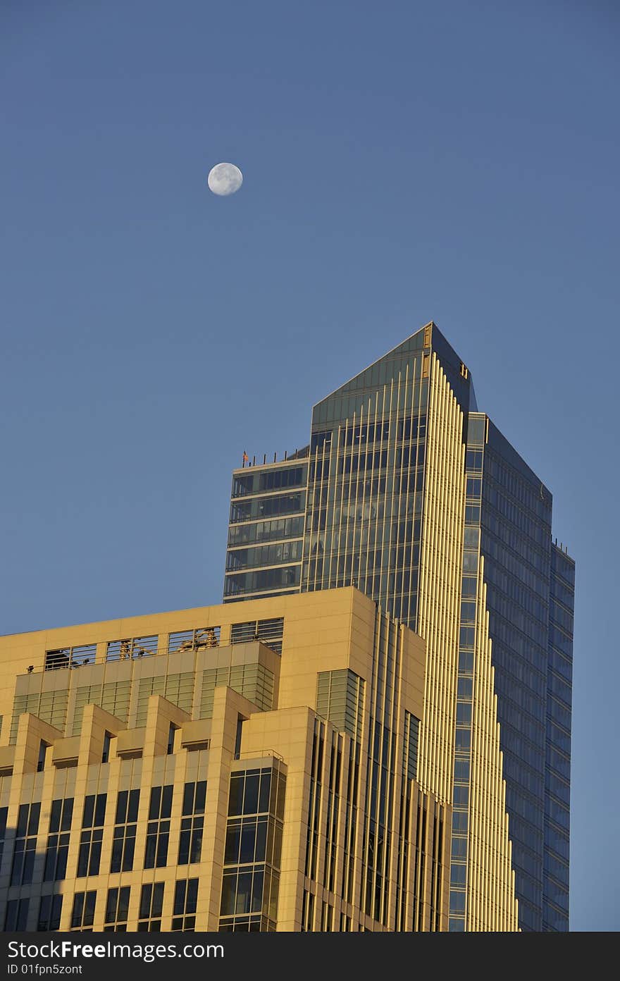 Moon over buildings