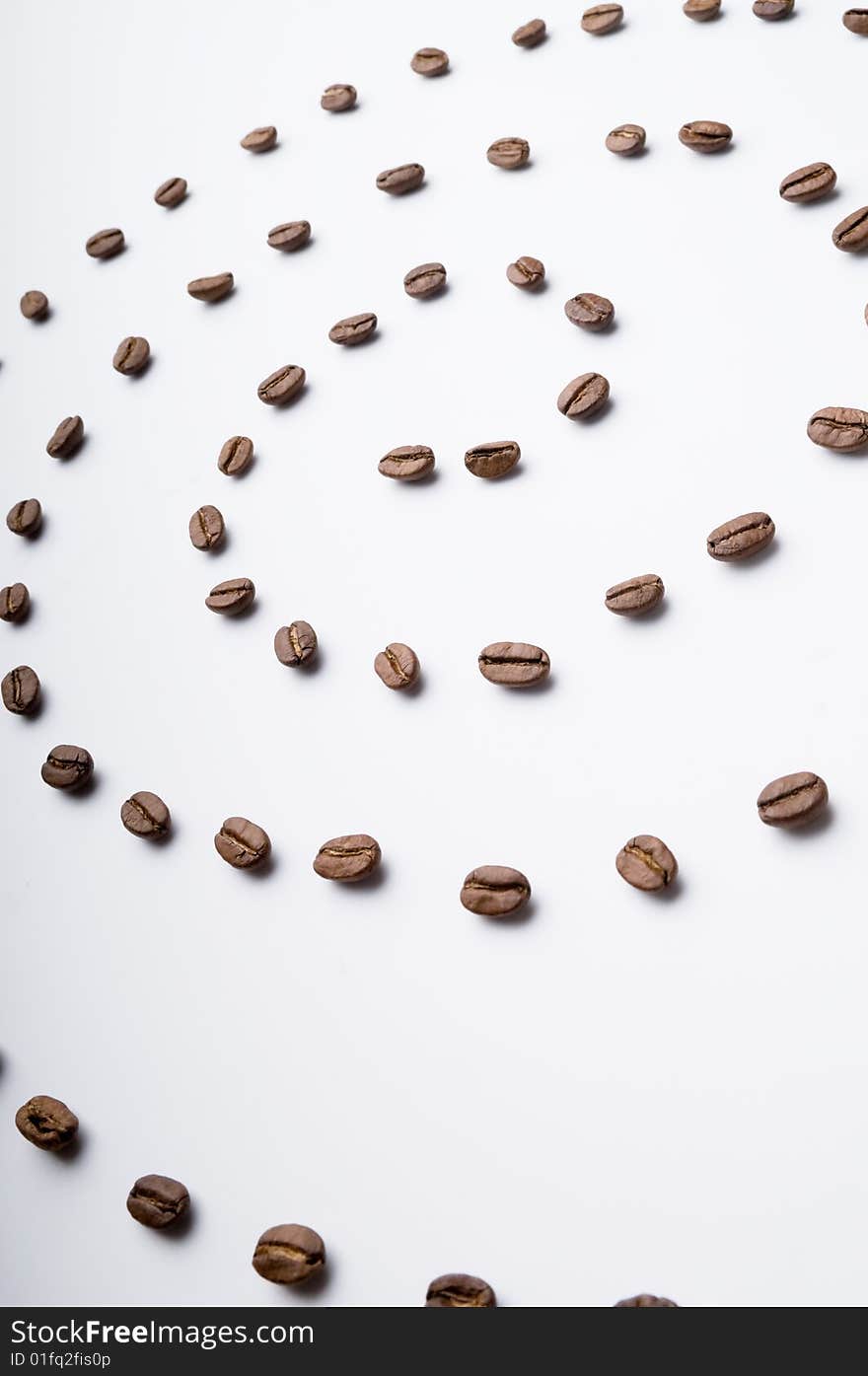 Spiral of grains on white surface