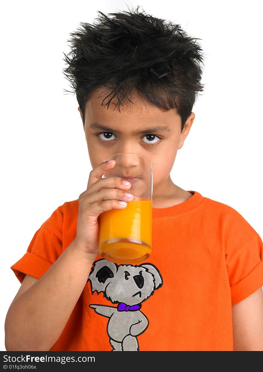 Boy drinking a glass of juic