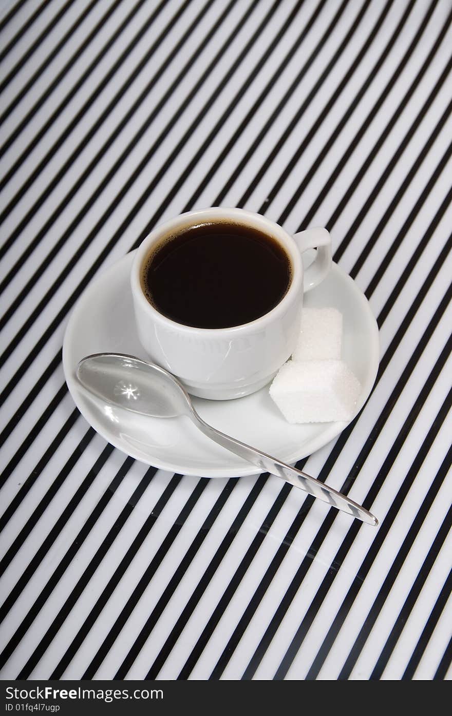 Coffee cup on the striped surface