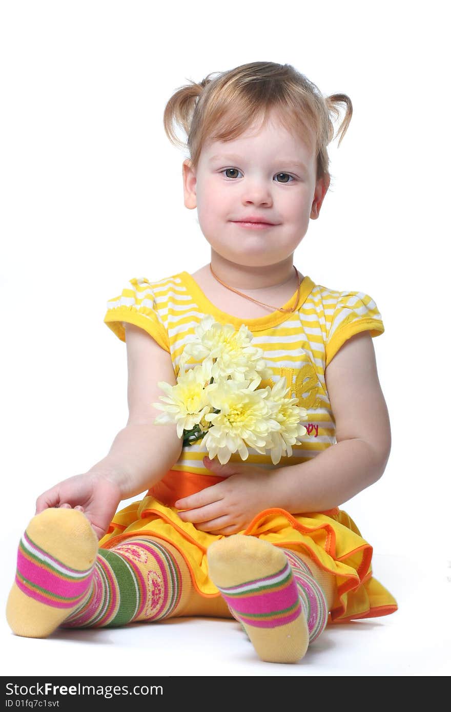 Funny little girl relaxing with yellow flowers. Funny little girl relaxing with yellow flowers