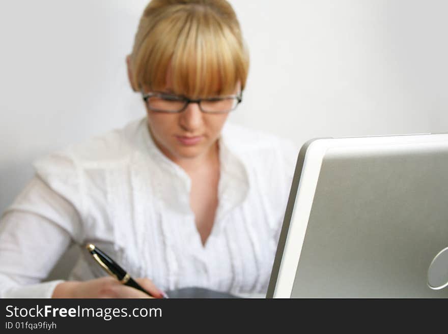 Businesswoman working in office. focus on a notebook. Businesswoman working in office. focus on a notebook