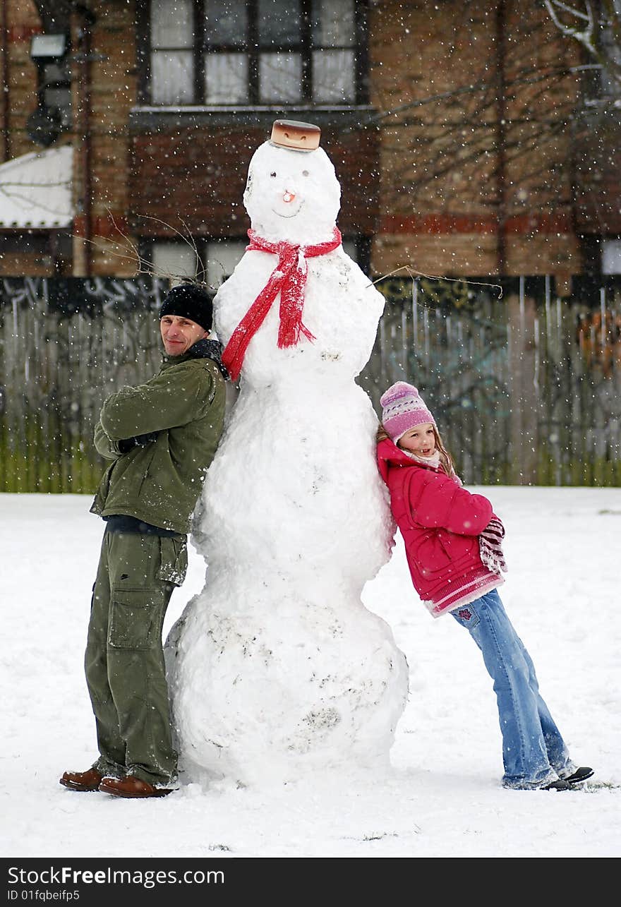 Dad and Daughter with Snowman