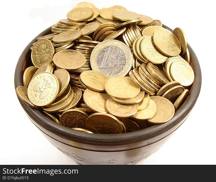 Bowl full of polish and euro coins. Bowl full of polish and euro coins