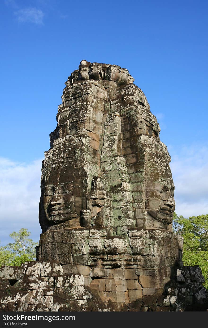 Face carved in rock at Bayon Temple at Angkor in Cambodia. A temple from the 12th century. Face carved in rock at Bayon Temple at Angkor in Cambodia. A temple from the 12th century.