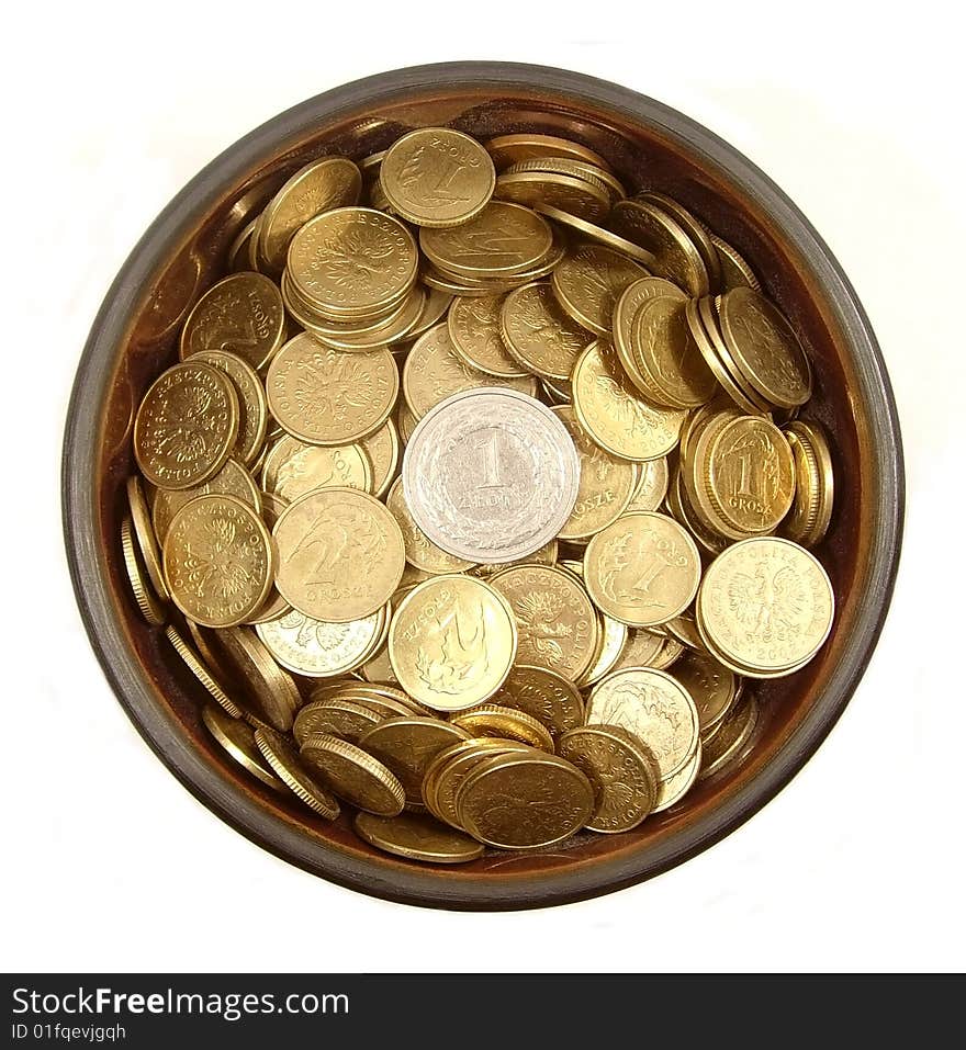 Coins in ancient bowl