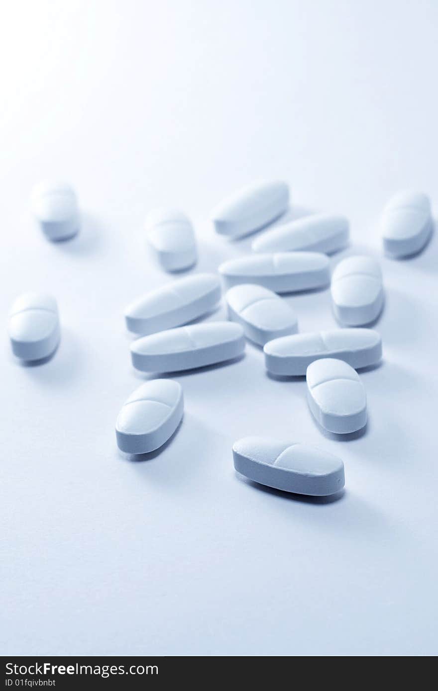 Oblong tablets on a white background