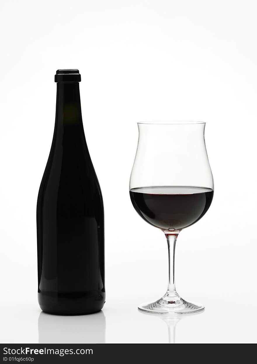 Red wine glass and bottle