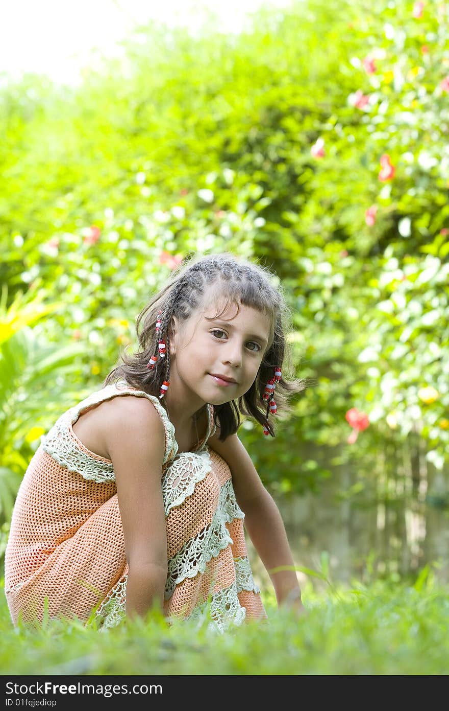 Portrait of little girl having good time in summer environment