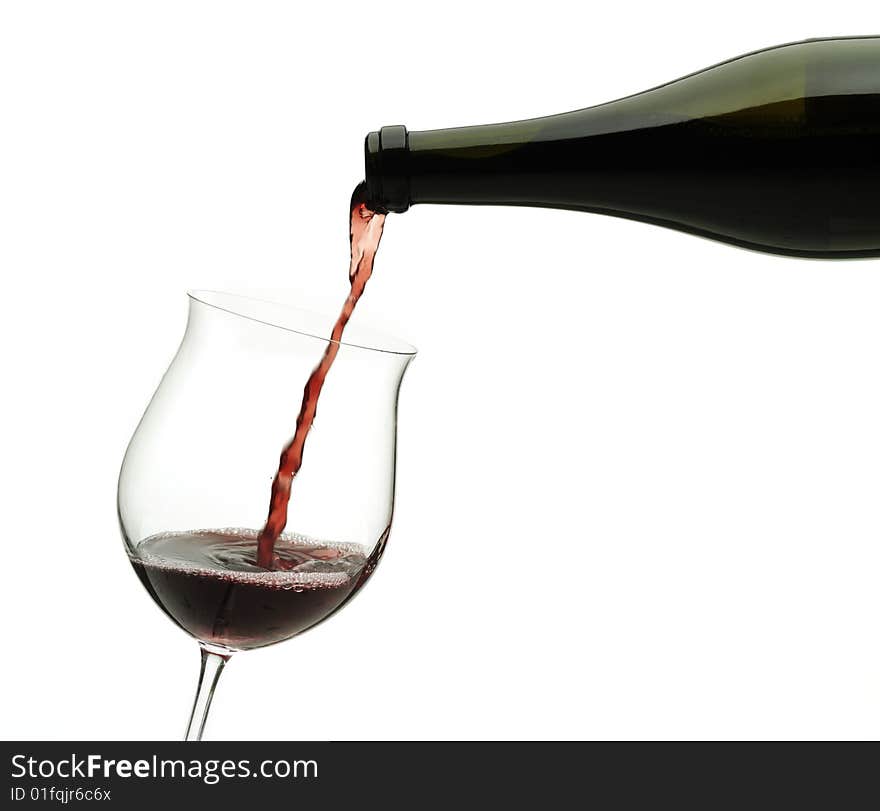 Red wine pouring down from a wine bottle