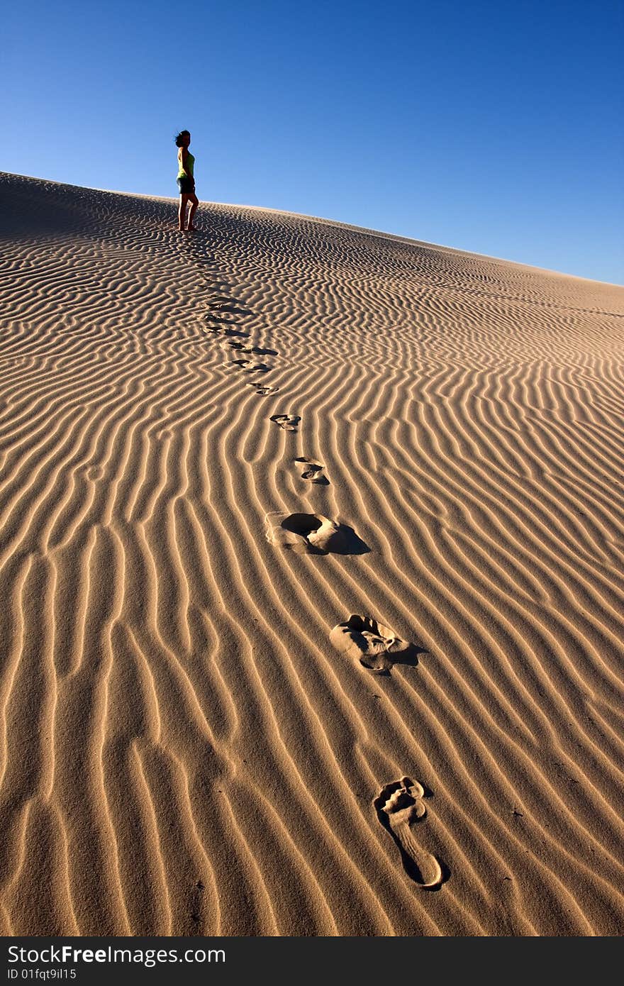 Girl walking in desert