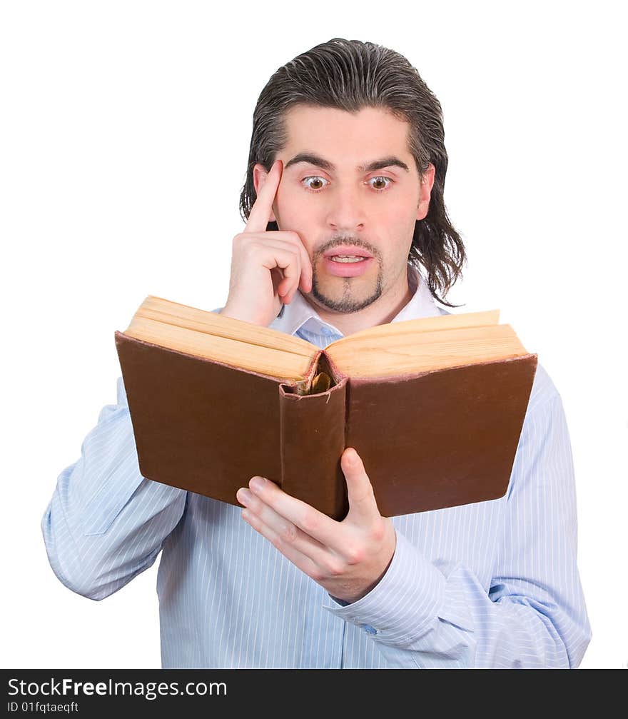 Young dark haired caucasian man in light blue shirt reads book and scratches his head in confusion isolated on white. Young dark haired caucasian man in light blue shirt reads book and scratches his head in confusion isolated on white