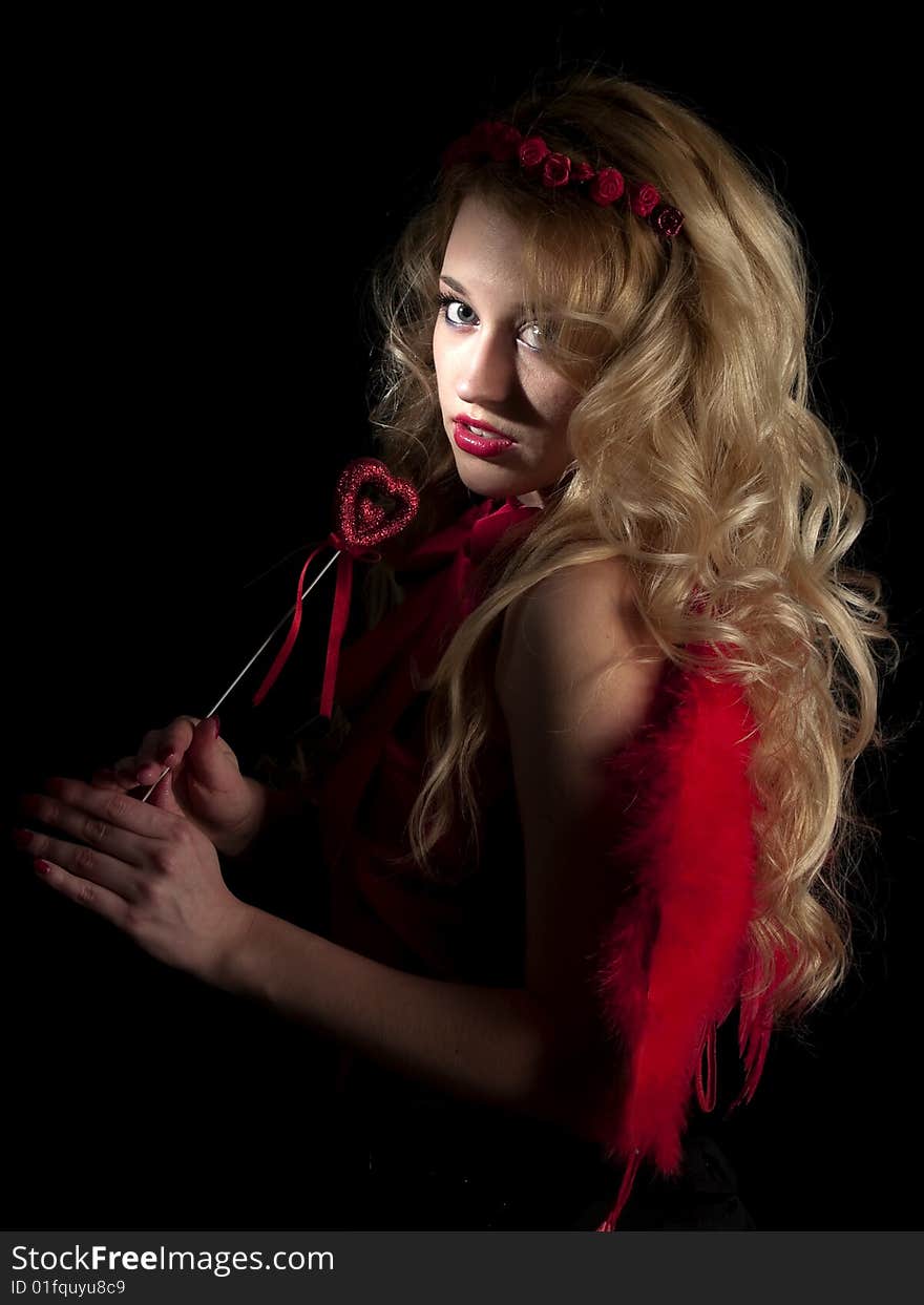 Beautiful teen lady in angel dress on black background. Beautiful teen lady in angel dress on black background