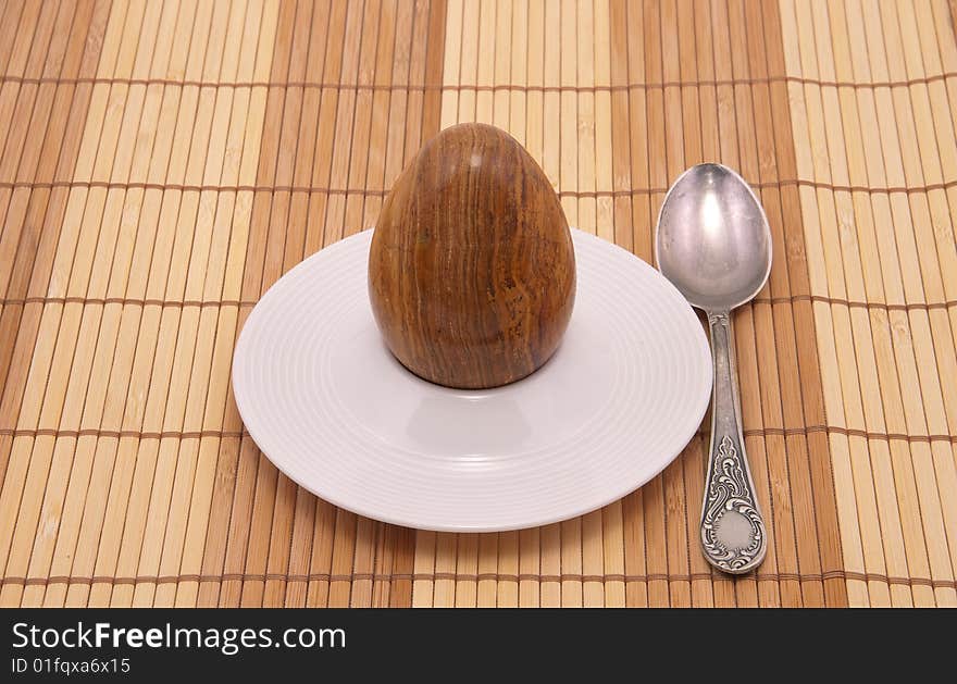 Served stone egg in a rest under egg