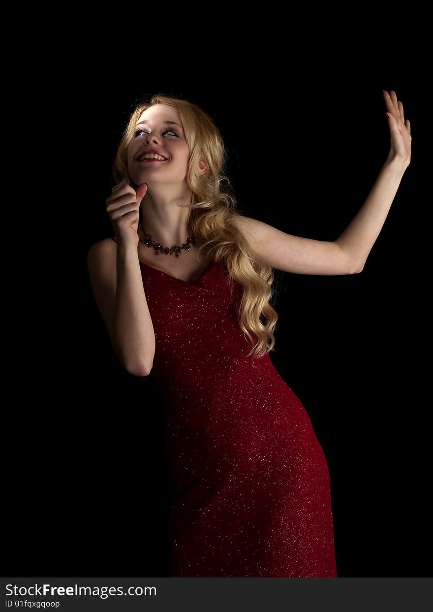 Beautiful blonde young lady in red dress singing. Beautiful blonde young lady in red dress singing