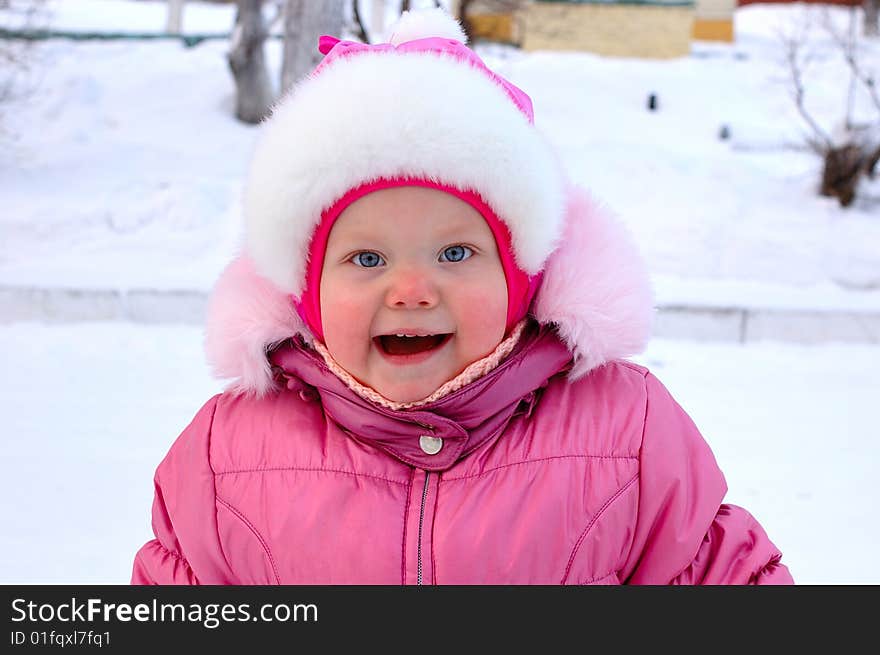 Pretty little girl in winter outerwear.