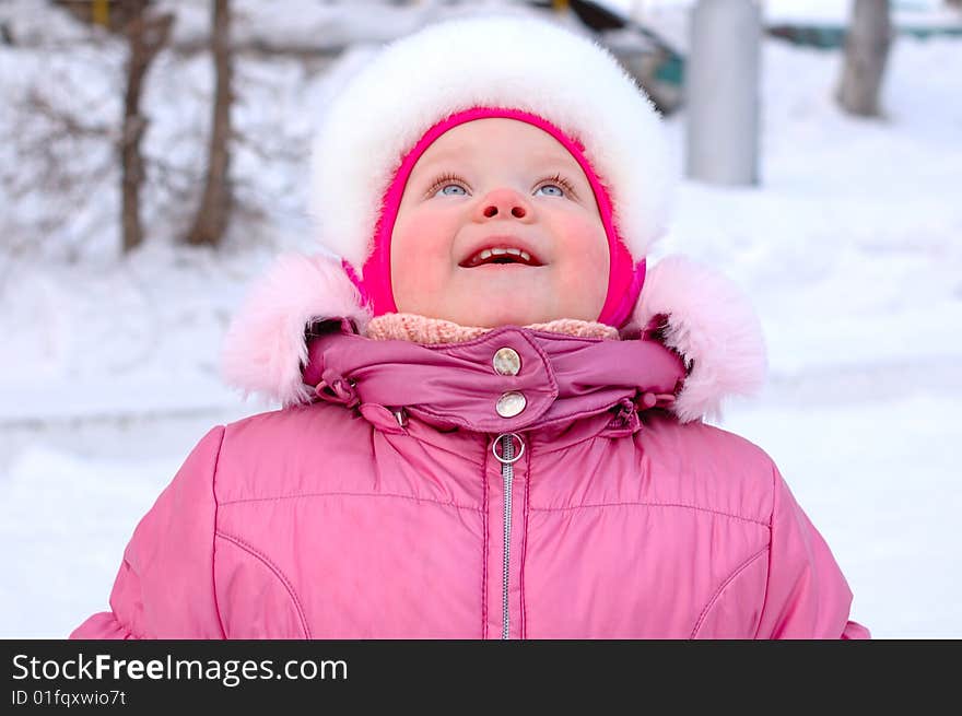 Pretty little girl in winter outerwear.