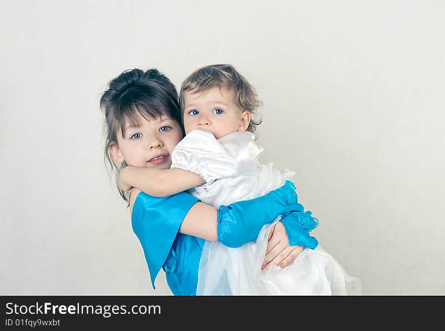 Two little sisters. Shot in studio. Two little sisters. Shot in studio.