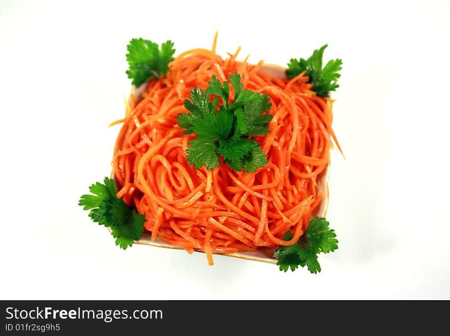 Lettuce from a carrot and parsley in a light-green dish