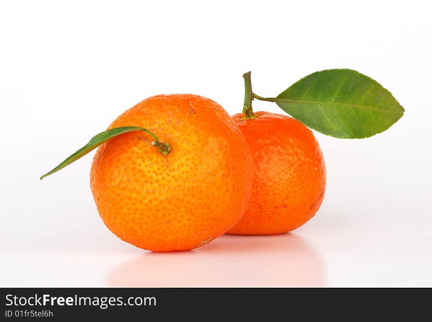 Orange with leaves on white background