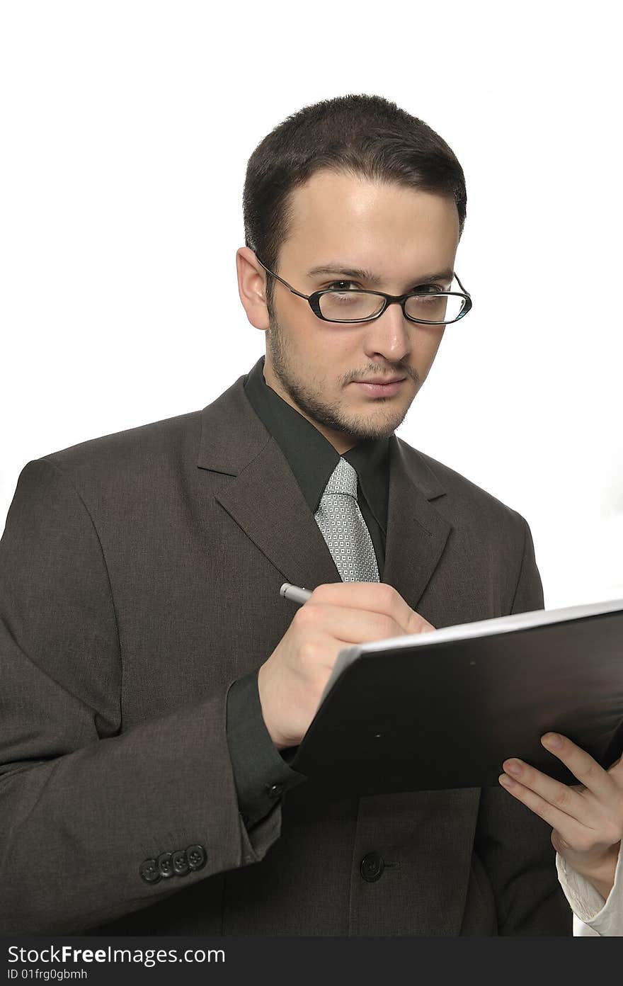 Young businessman signing a contract