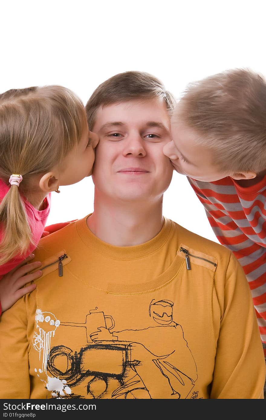 Children kiss the father on a cheek