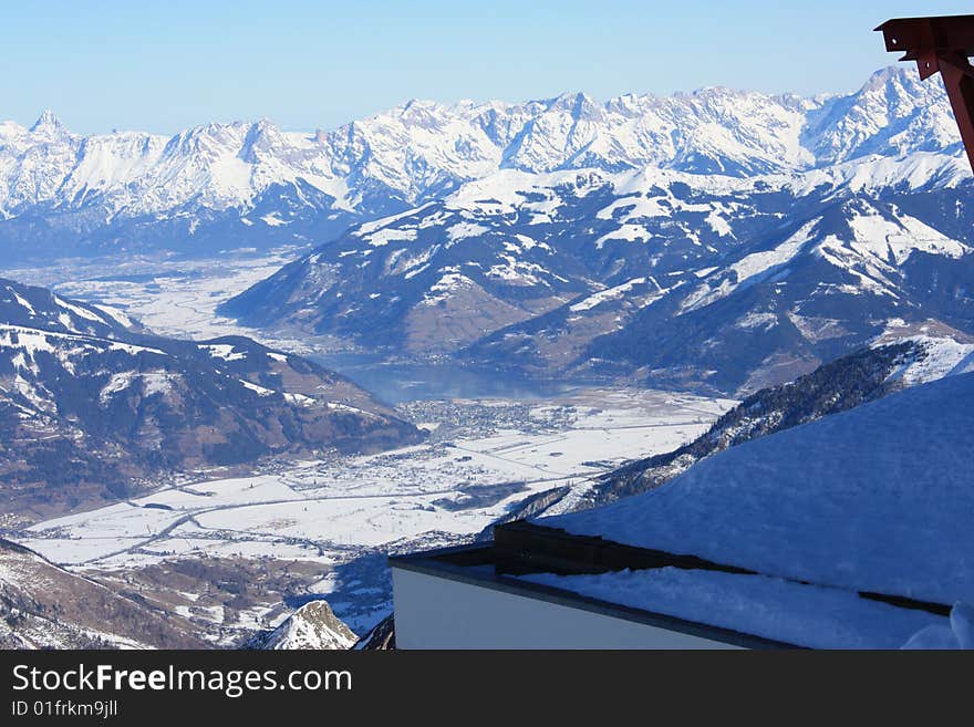 Austria. Mountains. The Alpes.Snow. The sun. Mountain tops.City in mountains. Mountain lake.