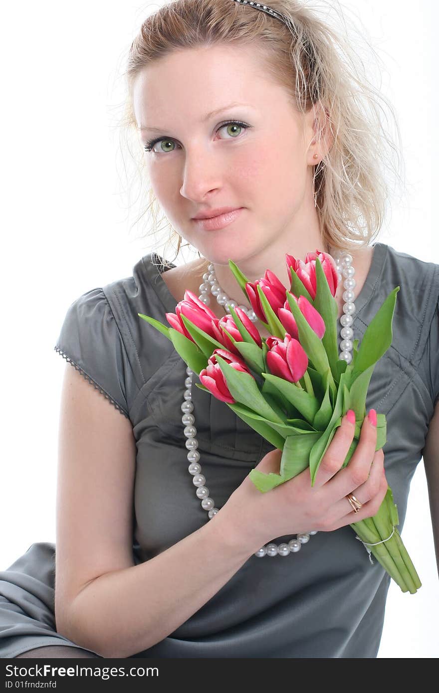 Beautiful young woman with pink tulips. Beautiful young woman with pink tulips