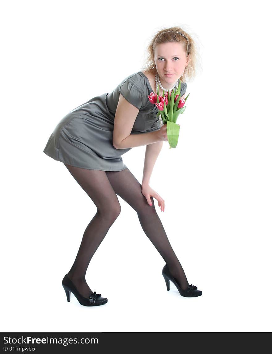 Beautiful young woman with pink tulips