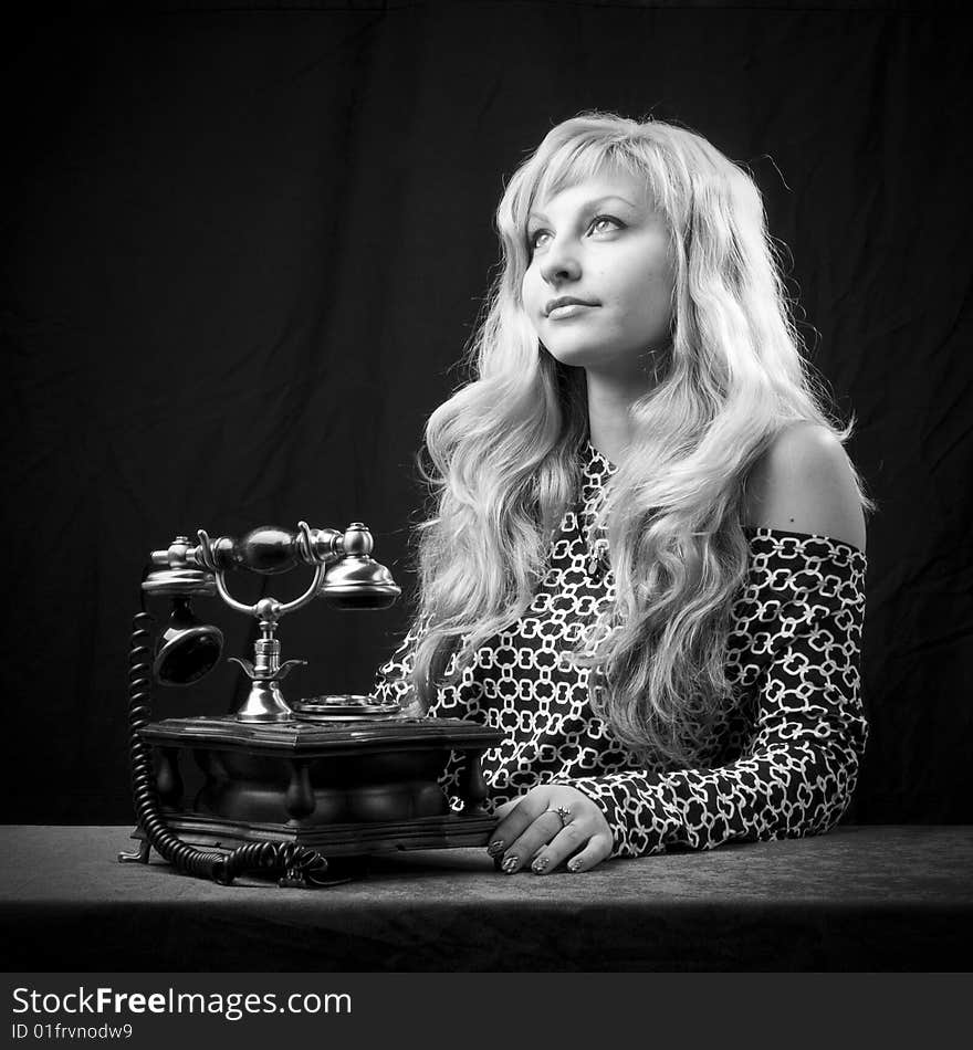 Caucasian woman talking on retro phone. Caucasian woman talking on retro phone.