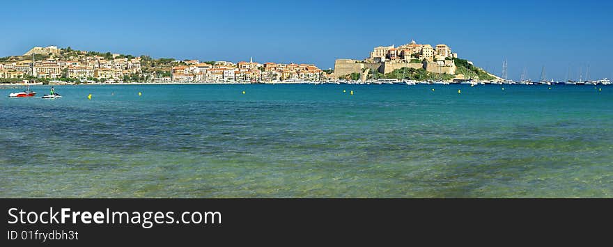 blue water and Calvi castle in Corsica. blue water and Calvi castle in Corsica