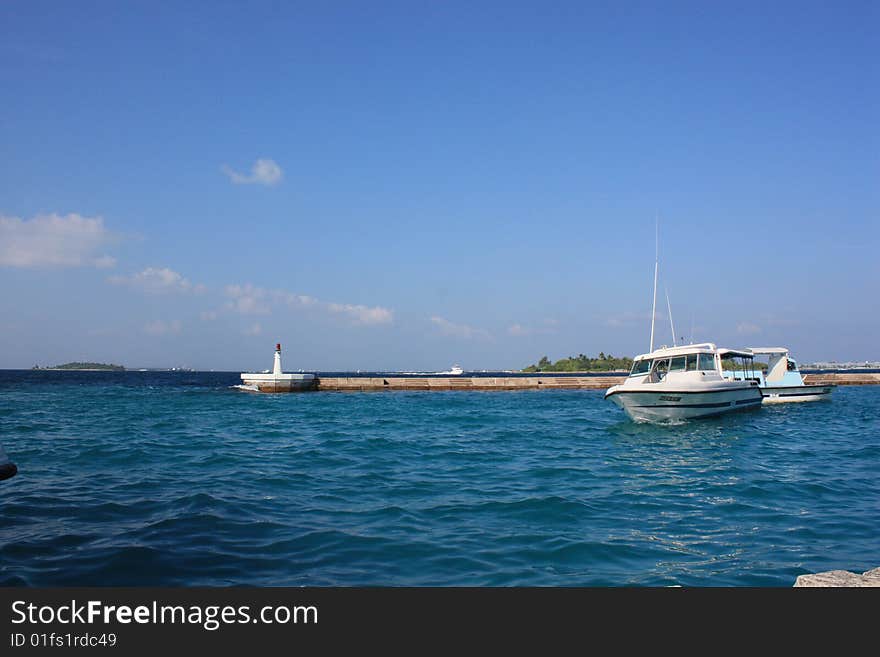 Speed boat near jetty in  sunny day. Speed boat near jetty in  sunny day