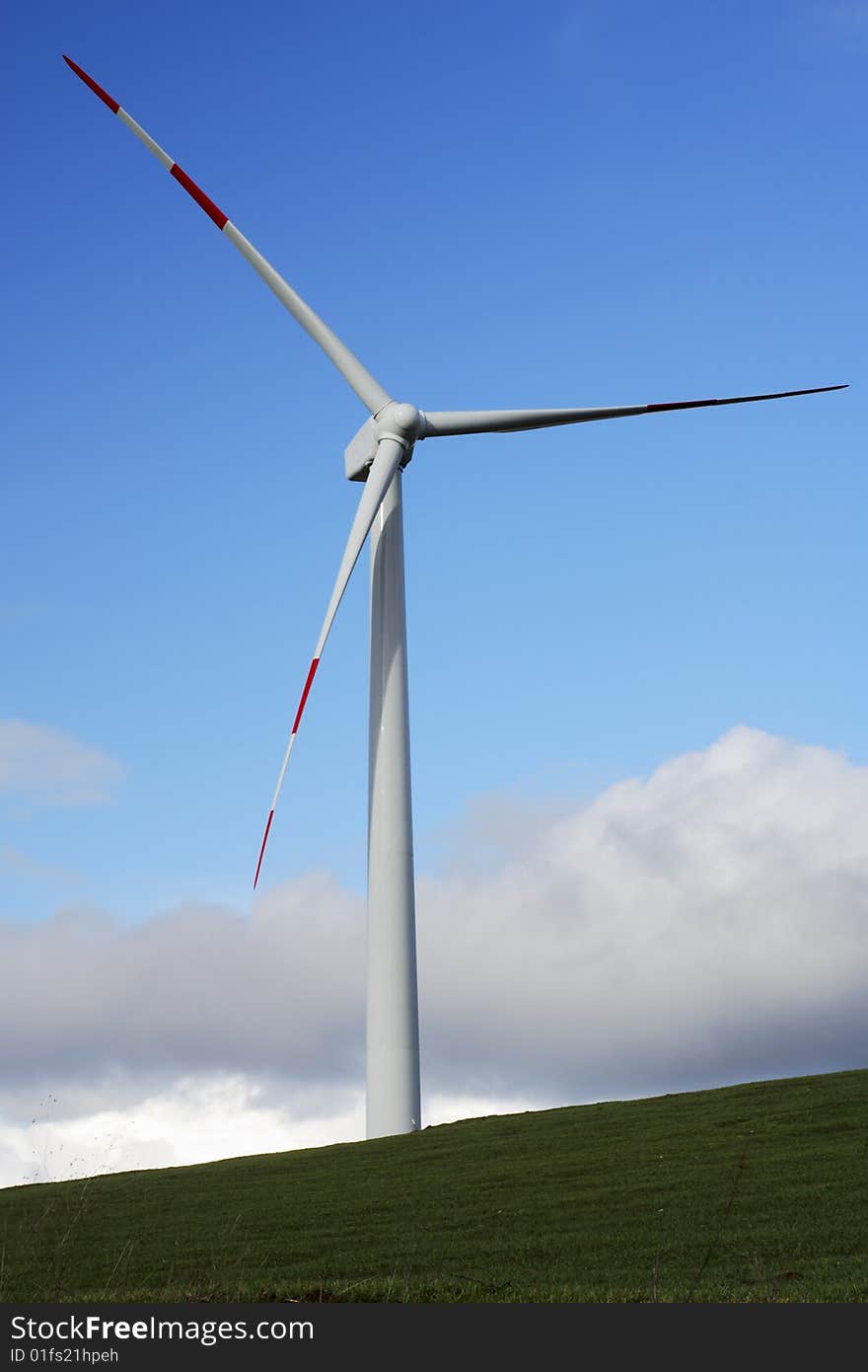 Modern and ecologic wind turbine and blue sky