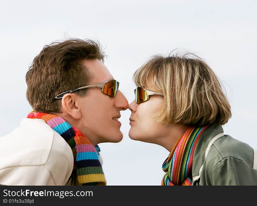 Young couple portrait in profile, isolated. Young couple portrait in profile, isolated