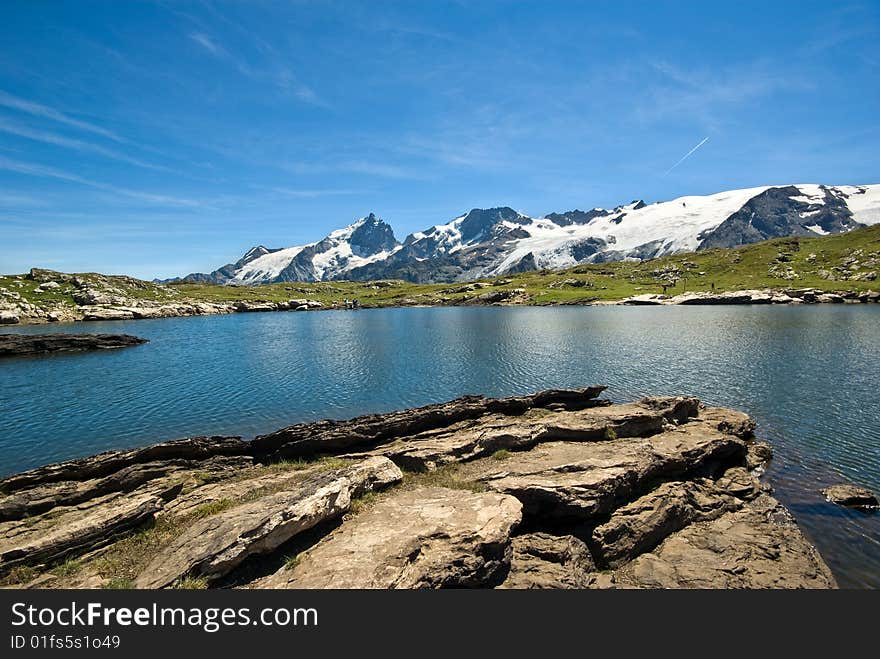 Lake and La Meije mountain landscape. Lake and La Meije mountain landscape