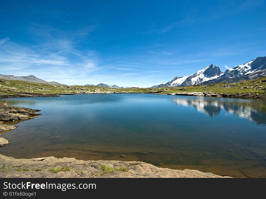 Lake and La Meije mountain landscape. Lake and La Meije mountain landscape