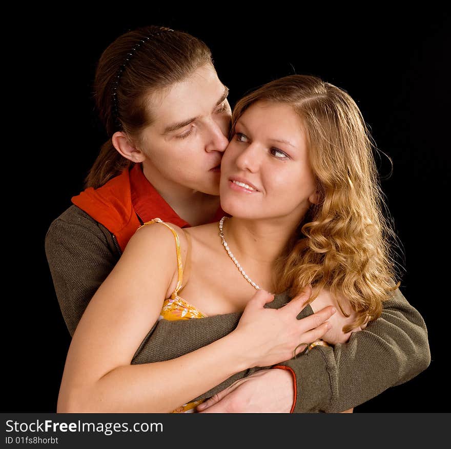 Loving couple on black background