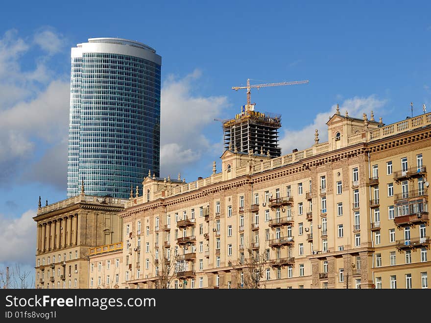 Building under construction,
Ahead of an office building is old stalin's times build, skyscraper against dramatic blue cloudy sky. Building under construction,
Ahead of an office building is old stalin's times build, skyscraper against dramatic blue cloudy sky