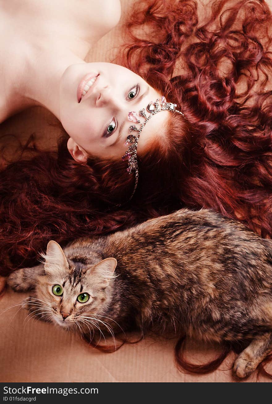 Young Girl Lying With A Cat