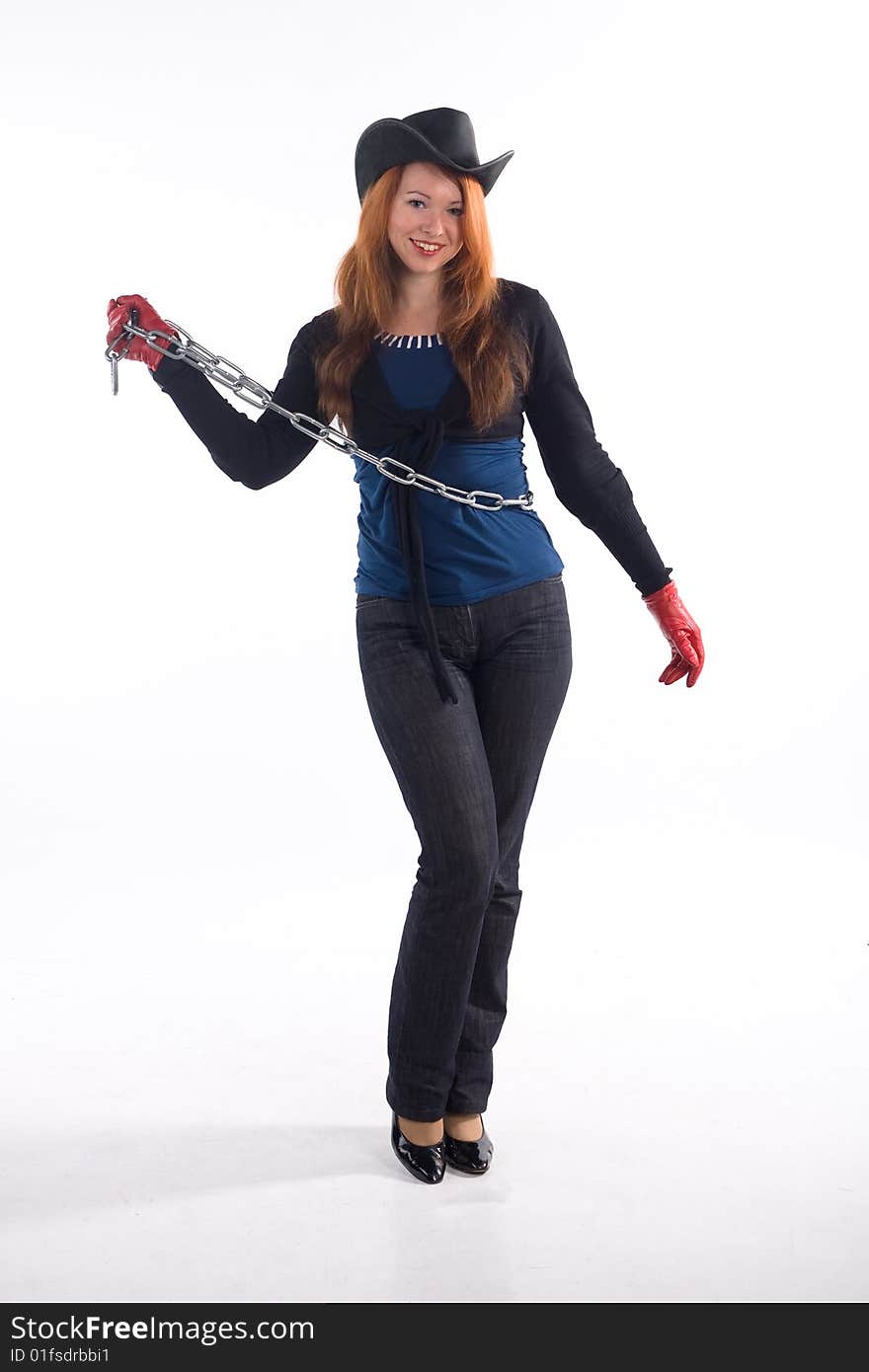 Young girl with red gloves, chain and black hat standing on white background. Young girl with red gloves, chain and black hat standing on white background