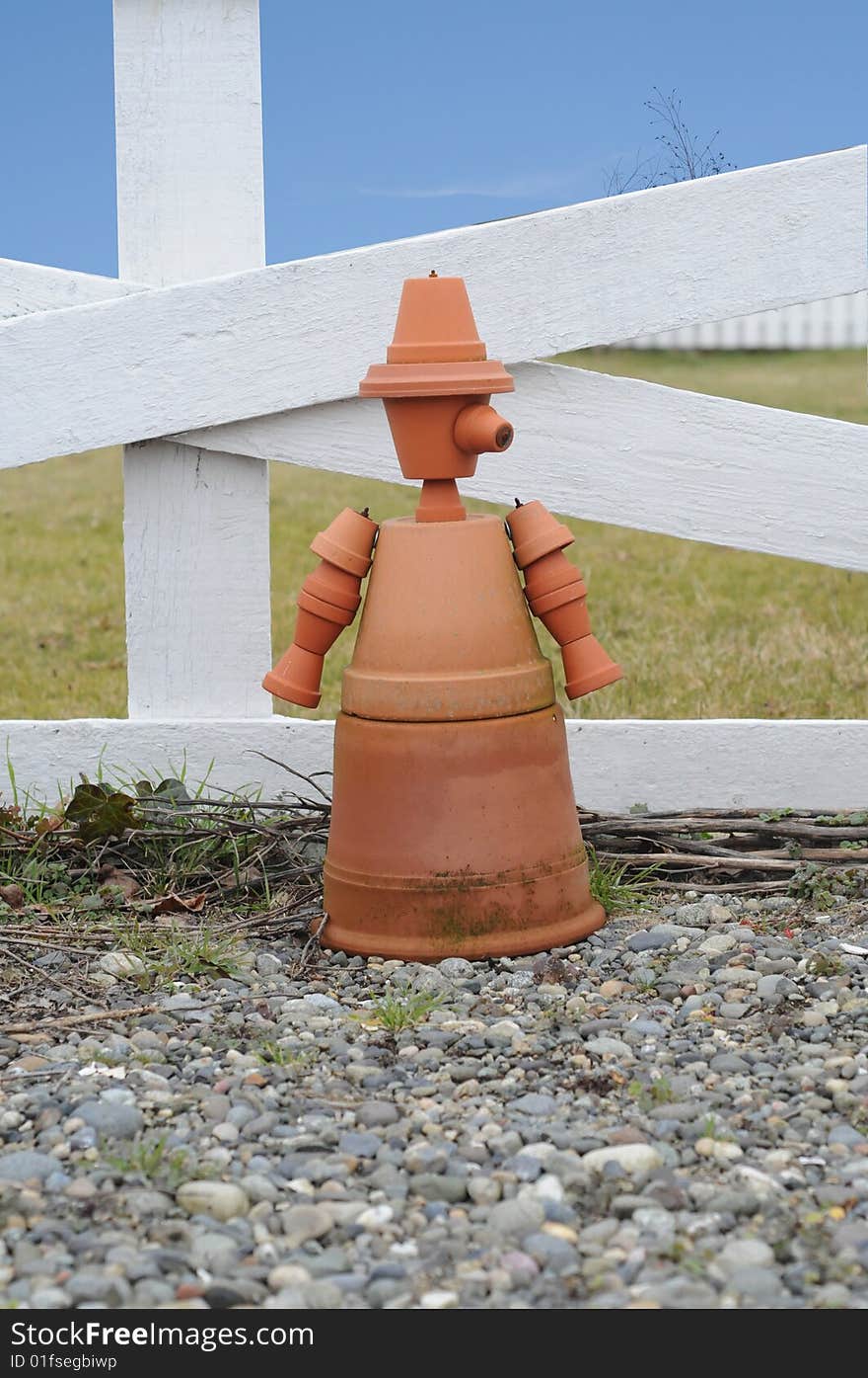 Figure of a person made out of clay plant pots. Figure of a person made out of clay plant pots.