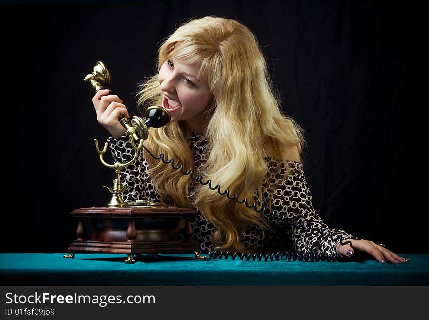 Caucasian woman talking on retro phone. Caucasian woman talking on retro phone.