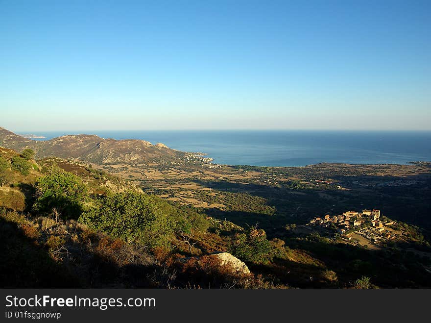 a village enlighting in corsica. a village enlighting in corsica