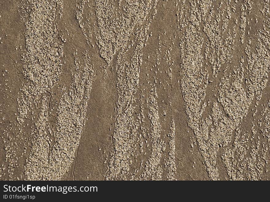 Sand pattern on ocean beach