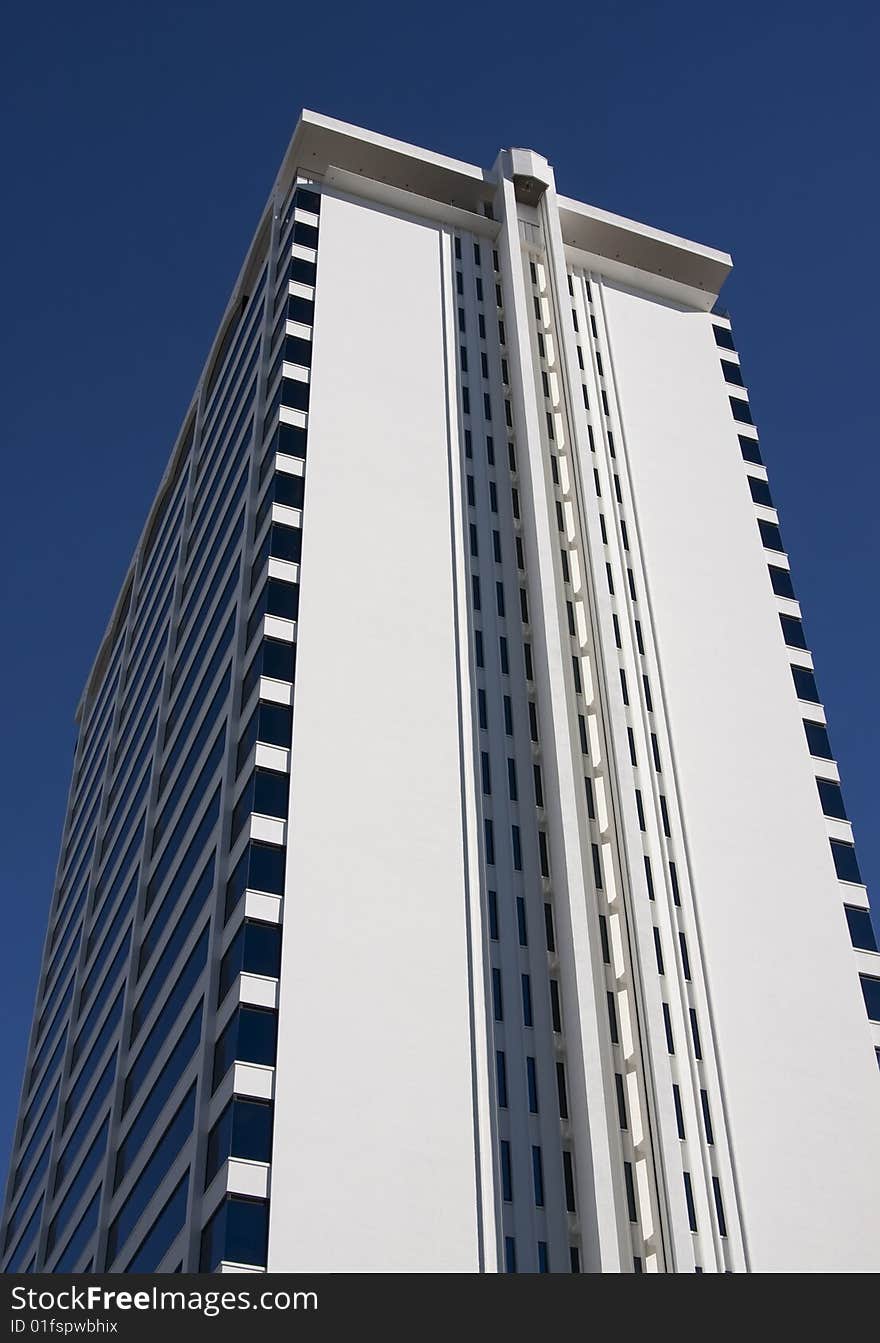 A modern city building reaches into the sky at San Diego. A modern city building reaches into the sky at San Diego